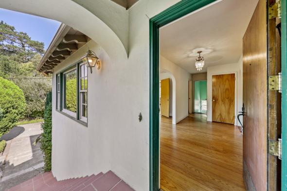 2 Berry Lane welcoming door into living room with wood floors