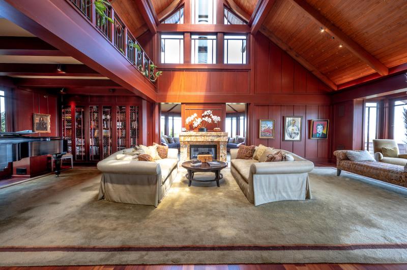 1 Via Vandyke Living room with vaulted ceiling. Beautiful wood. 