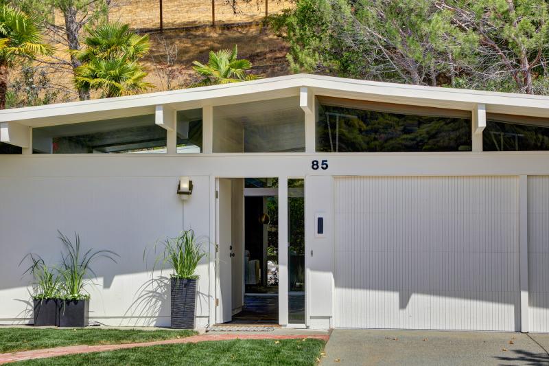 85 El Capitan Drive  A -frame white home with garage door