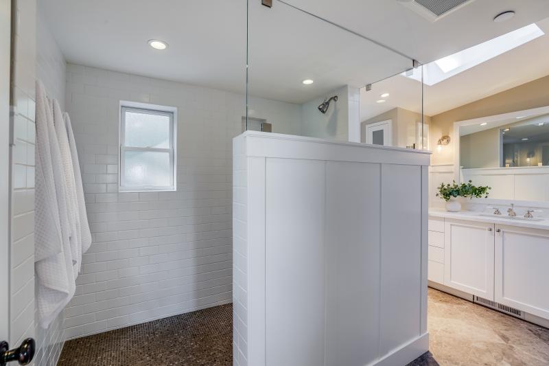 shower with white tiles