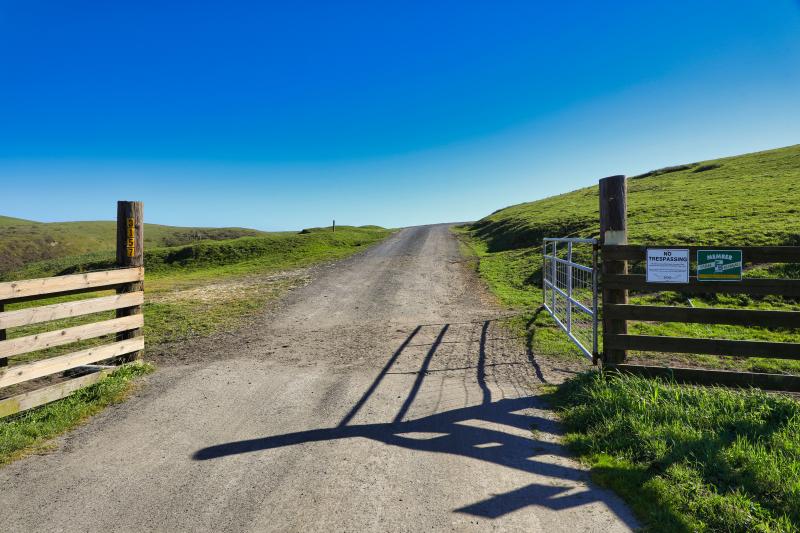 dirt road with gate
