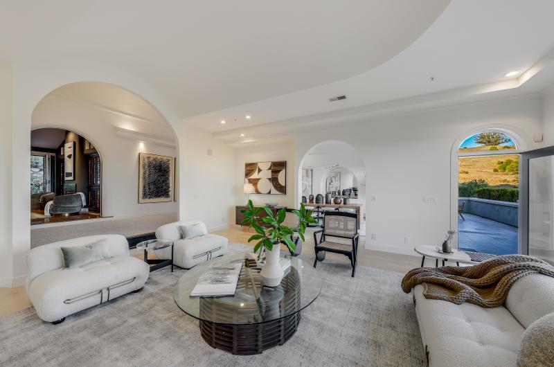 glass coffee table, white sofas