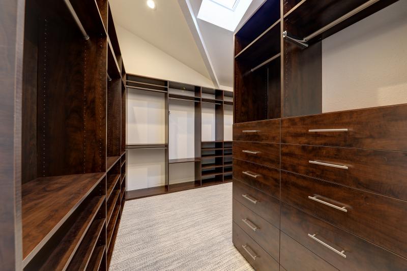 stately wood walk in closet