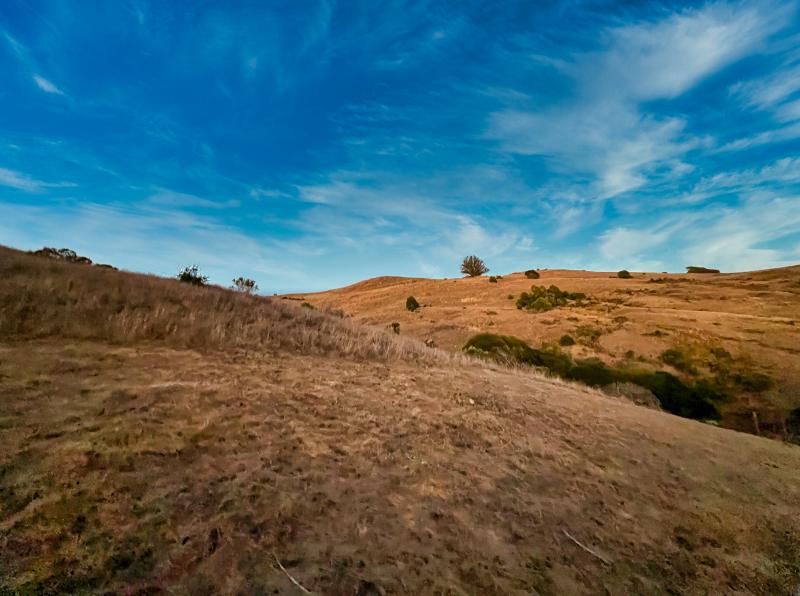 brown hill, blue sky