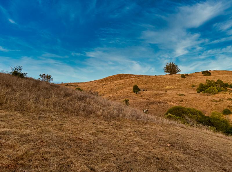 brown hill, blue sky